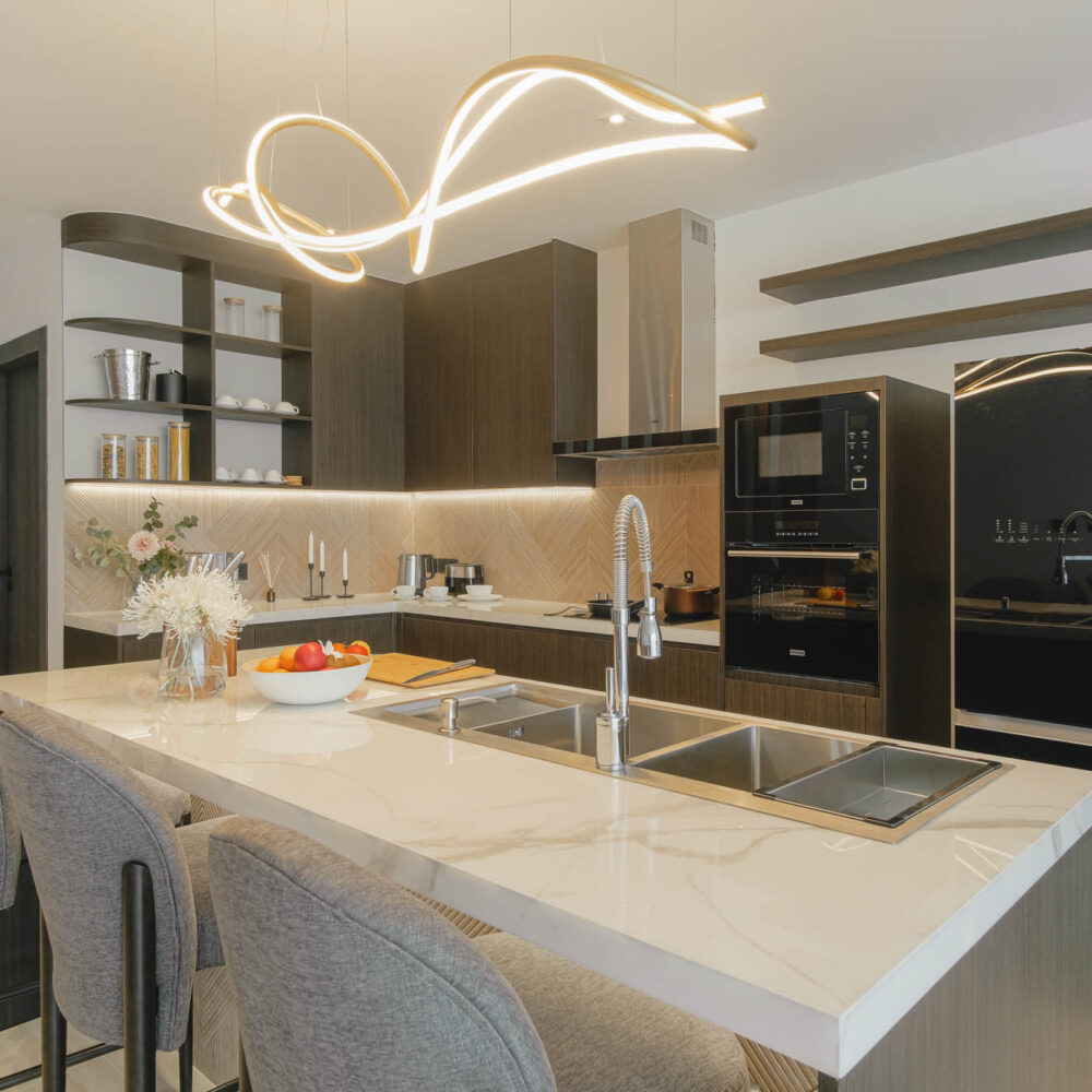 Luxurious kitchen and kitchen island with seating area and sink