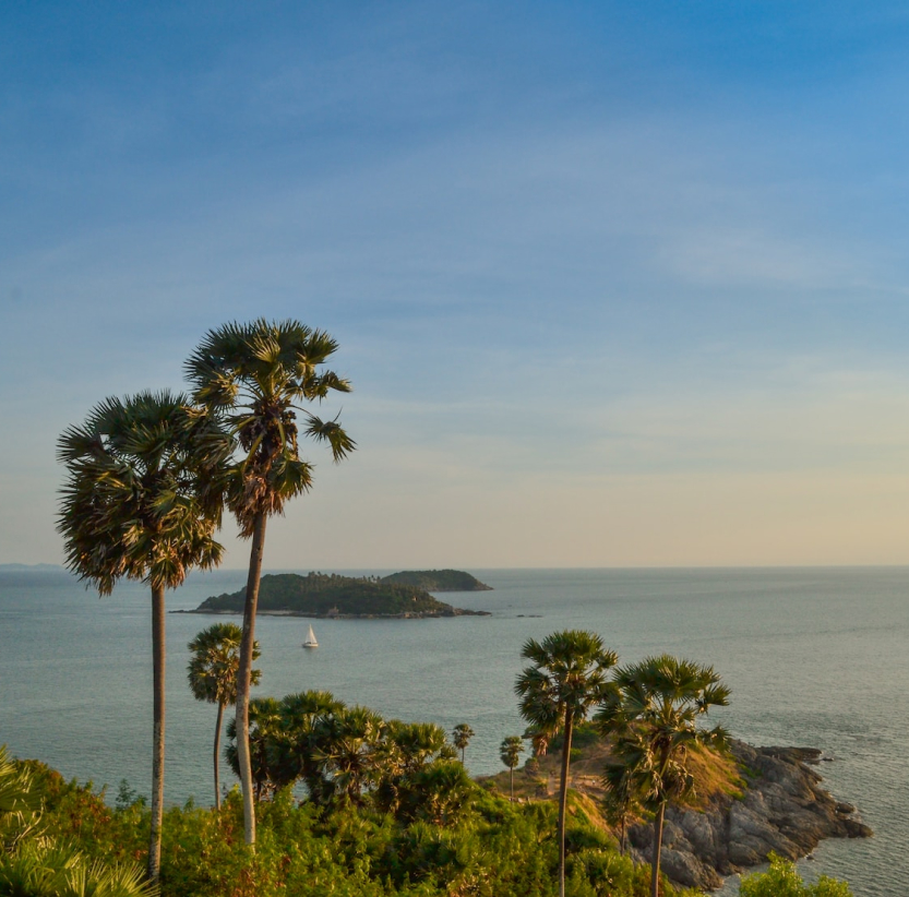 Laem Promthep sunset view with yacht sailing